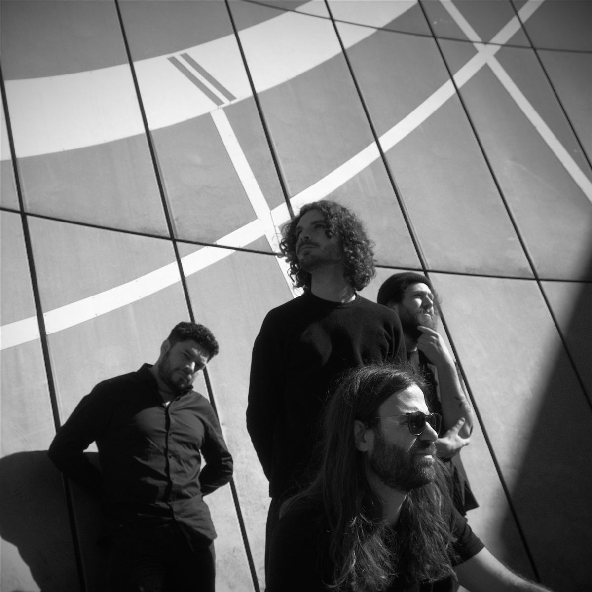 Black and white portrait of Digital Carbs against a curved wall. Photo: Lena Goth