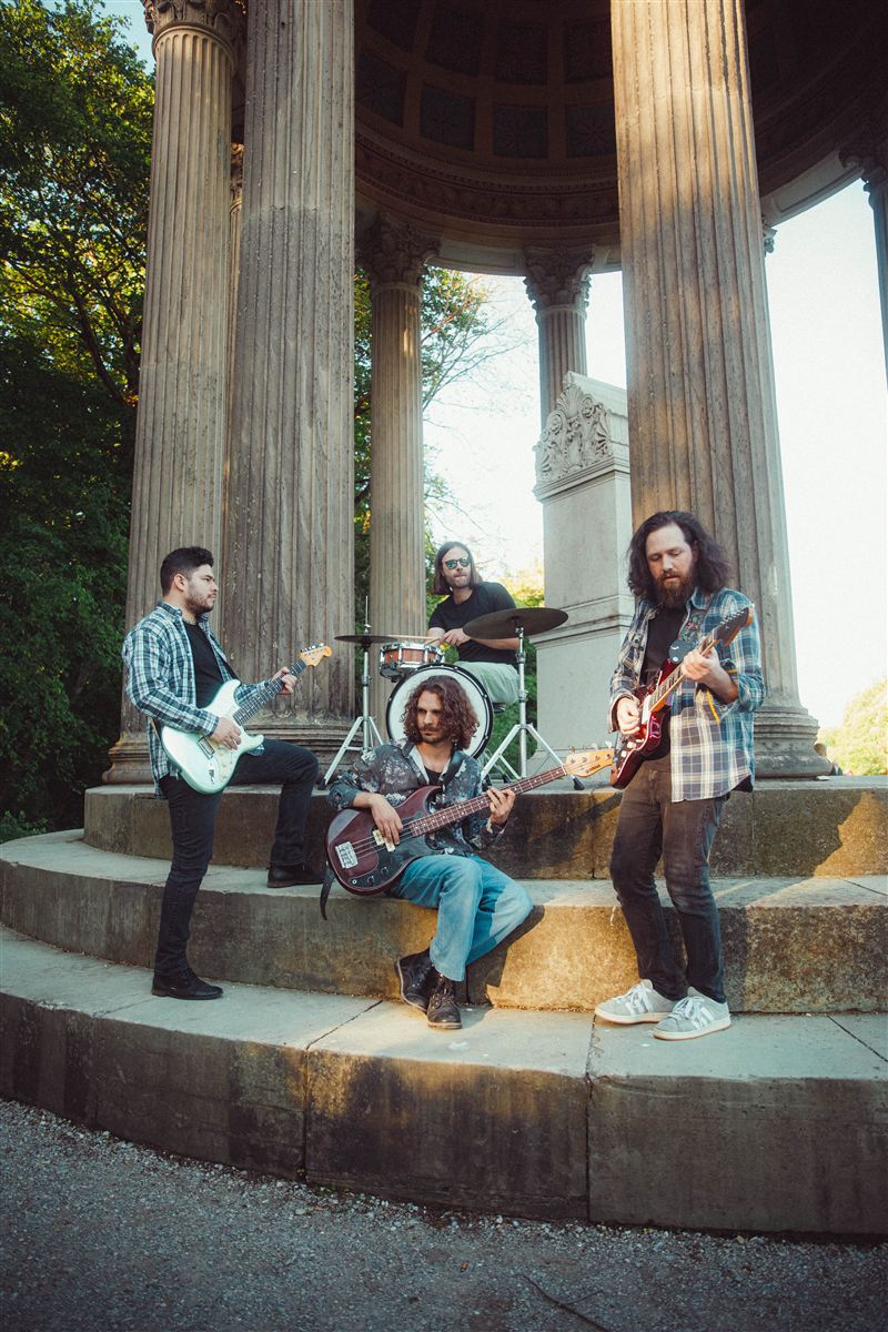 Digital Carbs playing on the steps of a round temple in a park. Photo: Celina Pratter