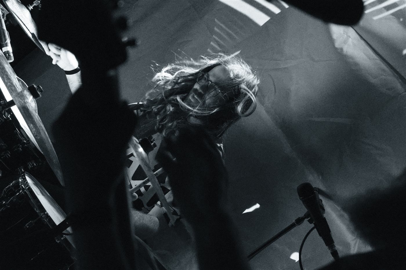 Guitarist with flying hair, seen from below